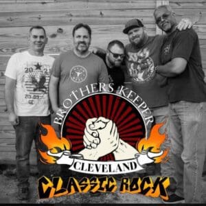 A group of five men posing behind a Cleveland Classic Rock logo.