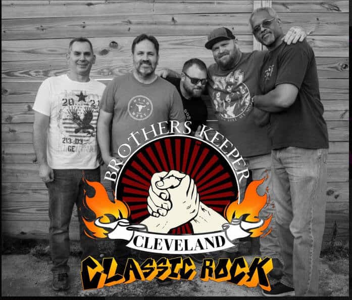 A group of five men posing behind a Cleveland Classic Rock logo.