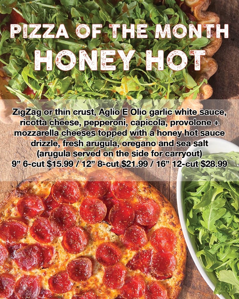 Honey hot pizza with arugula garnish.